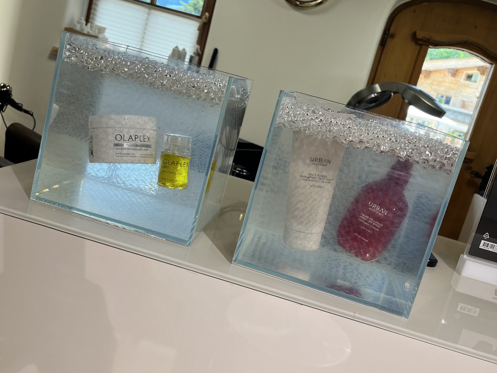 Olaplex and Urban Alchemy presented in glass cubes - product detail at HAIRLODGE Stanglwirt.